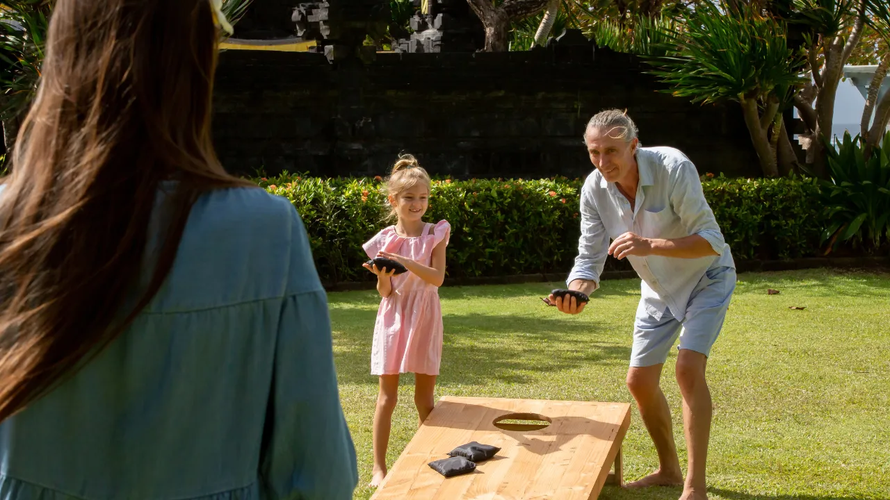 Family tossing beanbags in an outdoor cornhole Austin style game.
