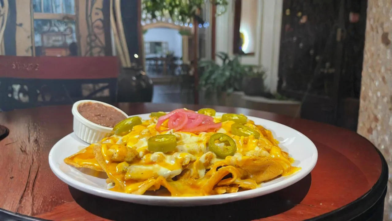 Nachos with cheese, jalapenos, and pickled onions